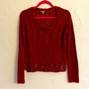 Light burgundy sweater.